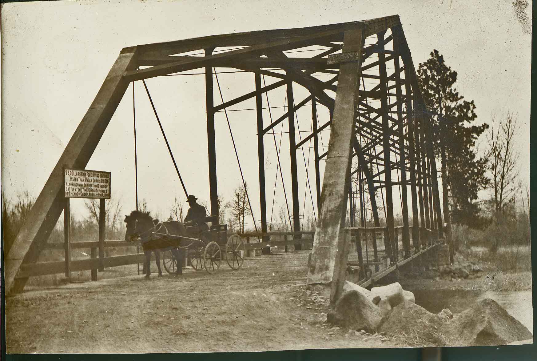 Nelson Bridge with John Nelson, engineer responsible for the diversion dam built for creating power for Yakima. Future bridges built at this site are known as Powerhouse Bridge