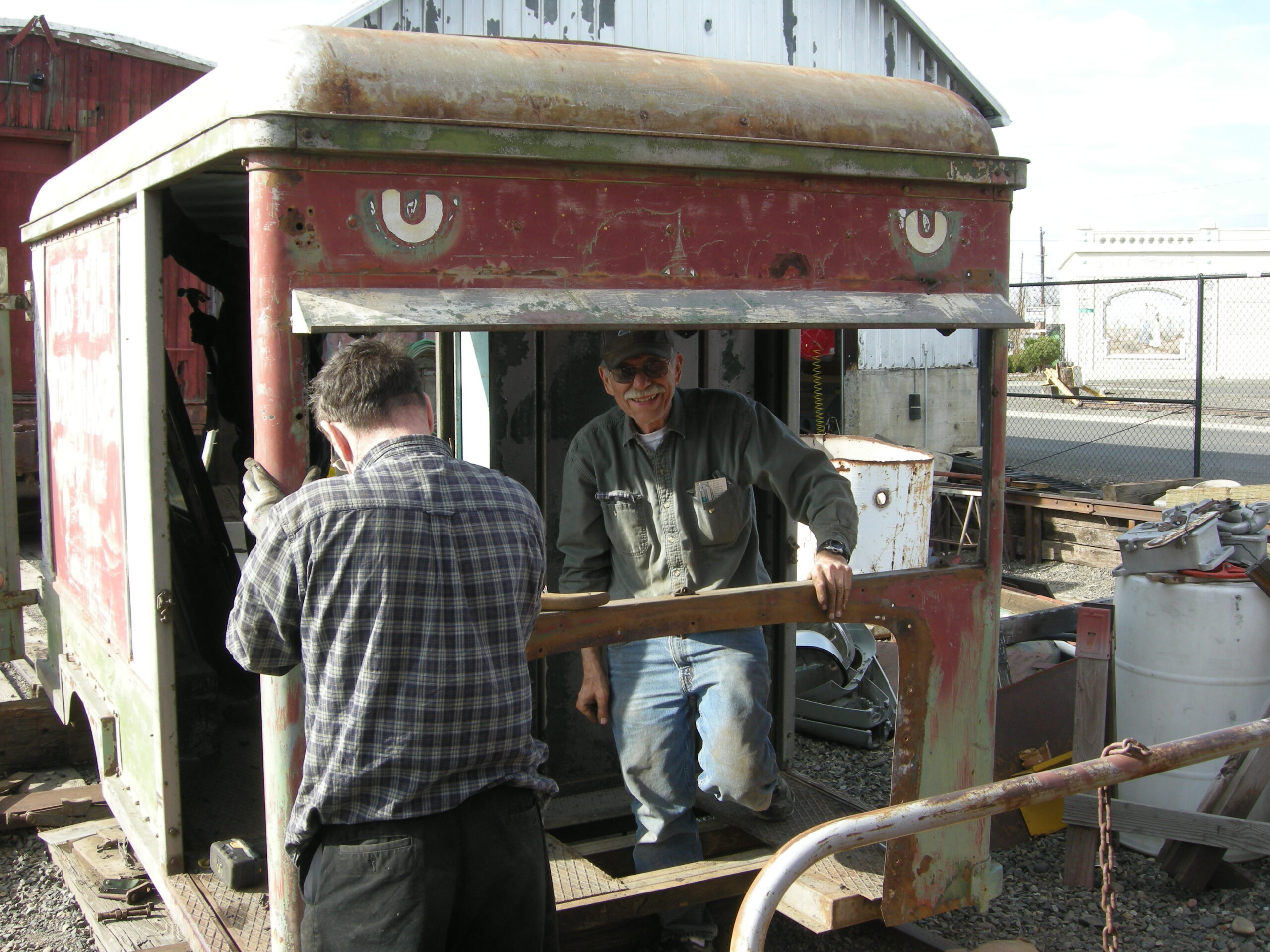 Doug Shearer and Piper Hale working on the Railway Express Agency delivery truck